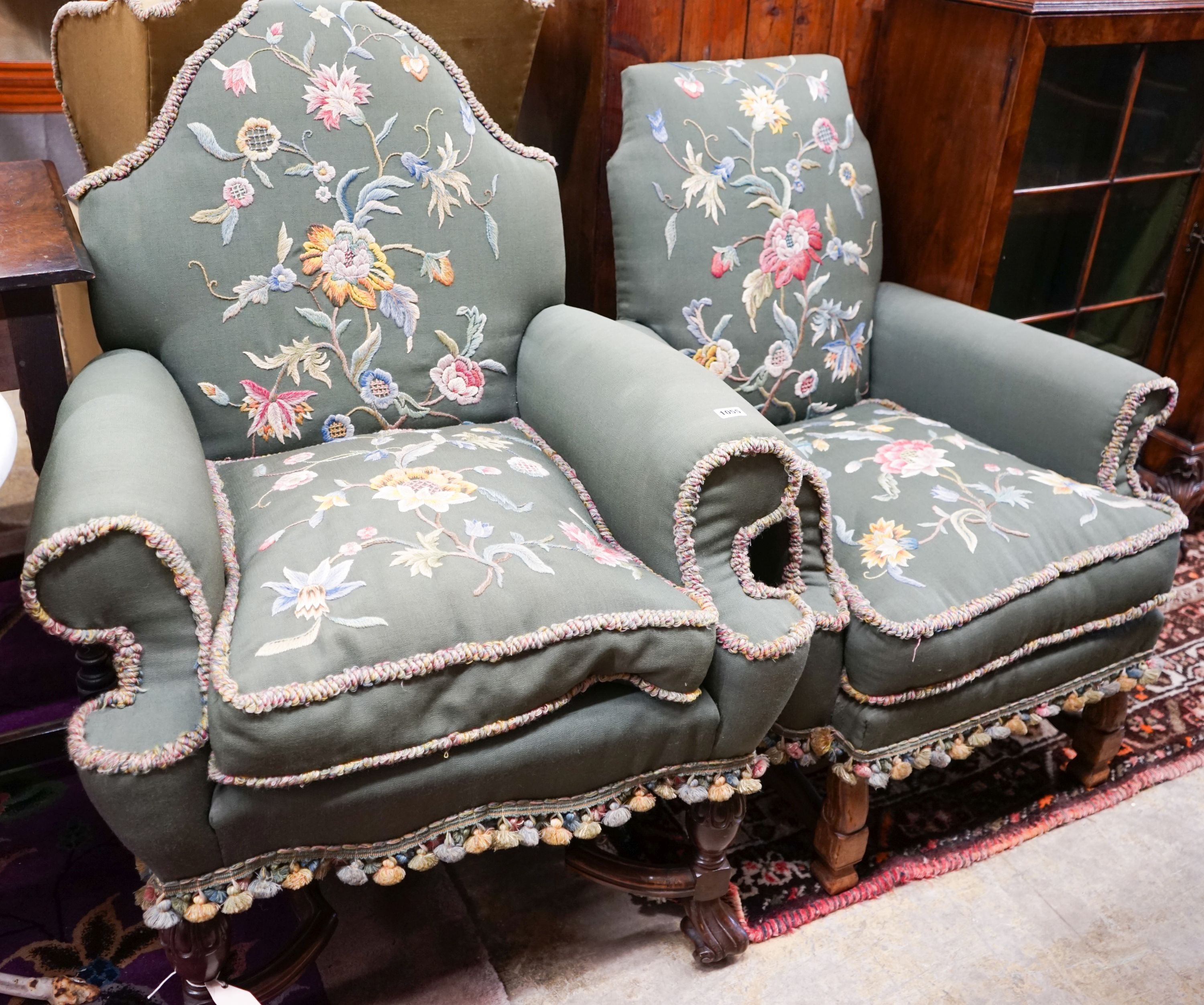 Two armchairs with shaped backs, each upholstered in green with embroidered flowers, on shaped cross stretchers with scrolled feet, larger width 80cm, depth 70cm, height 102cm